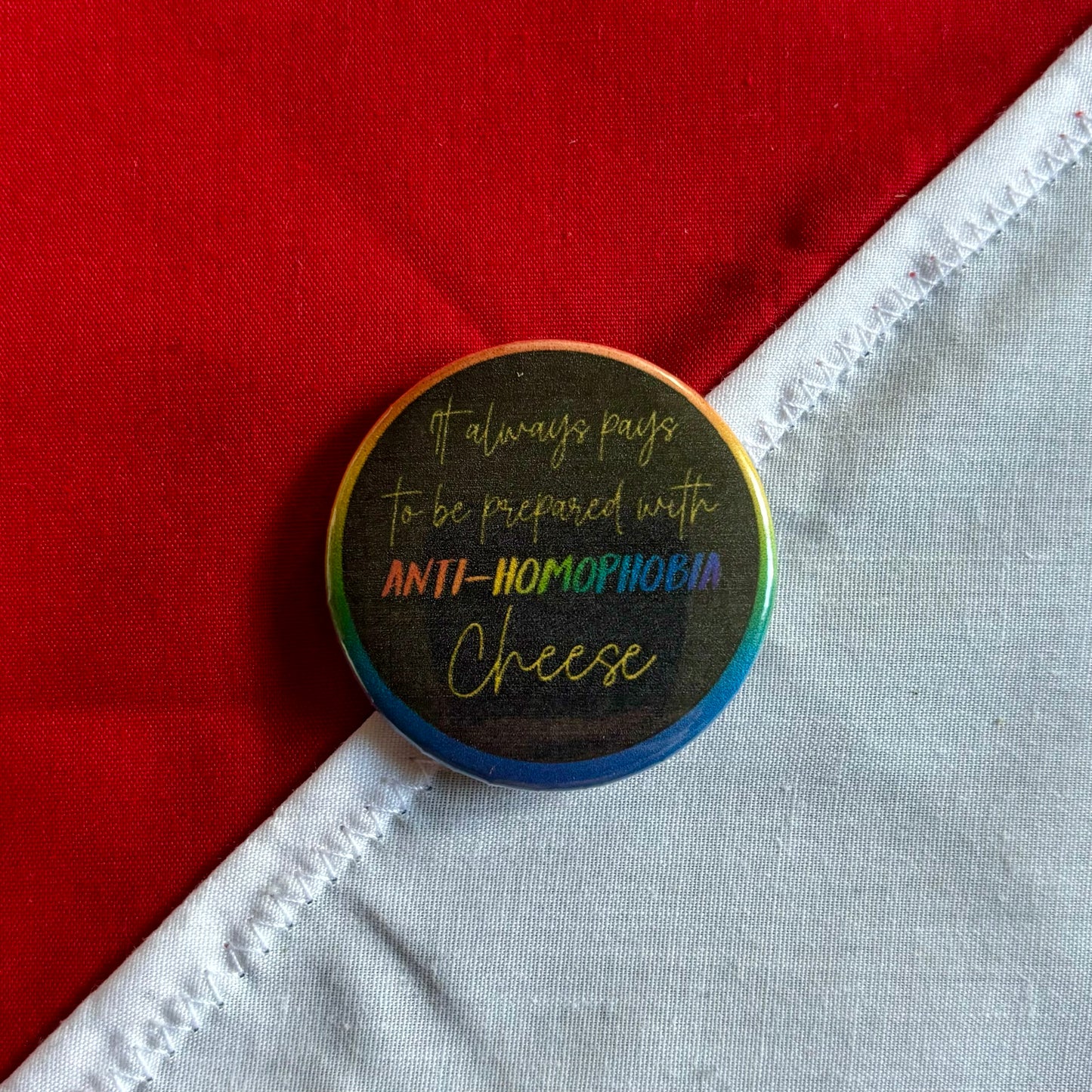 Anti-homophobia cheese badge